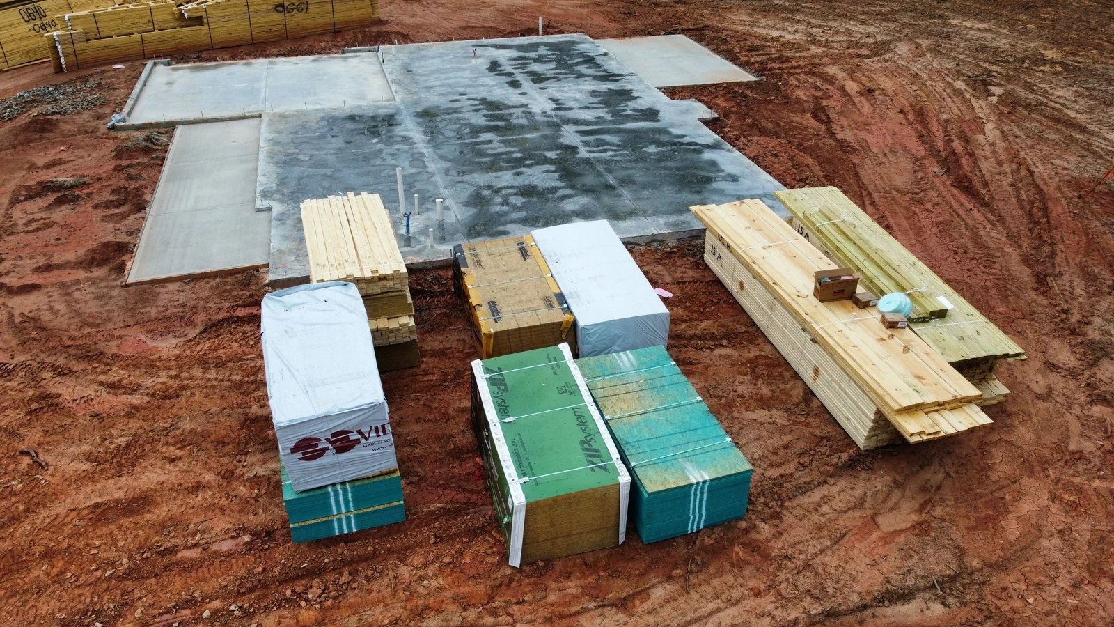 Slab poured and framing materials staged on site