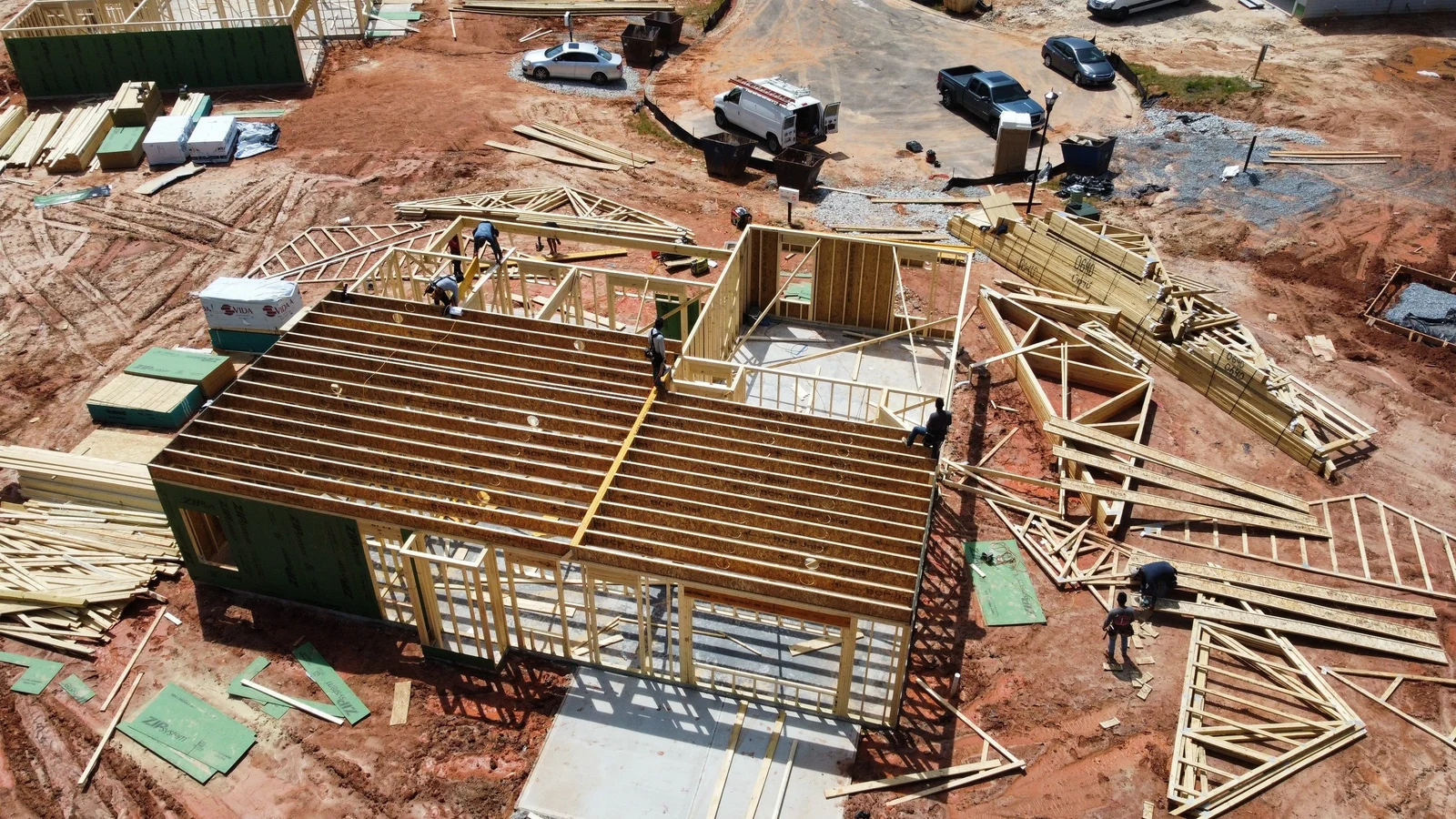 Slab poured and framing materials staged on site