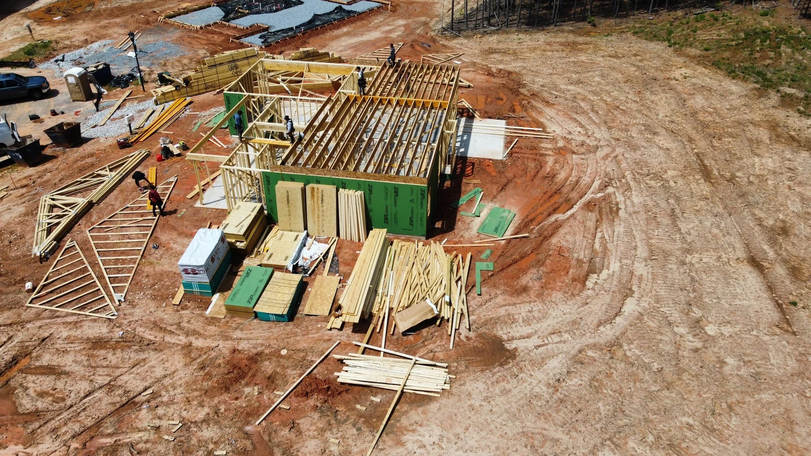 Slab poured and framing materials staged on site