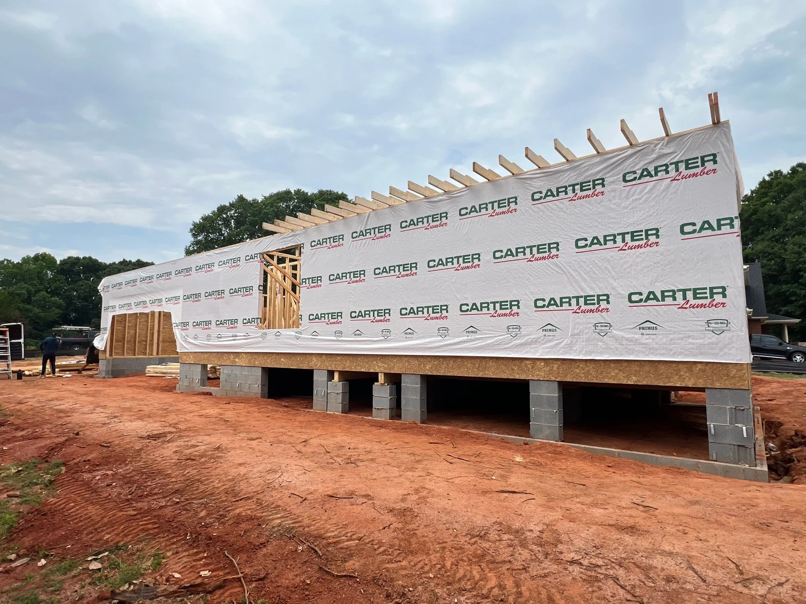 Custom home frame with roof trusses set