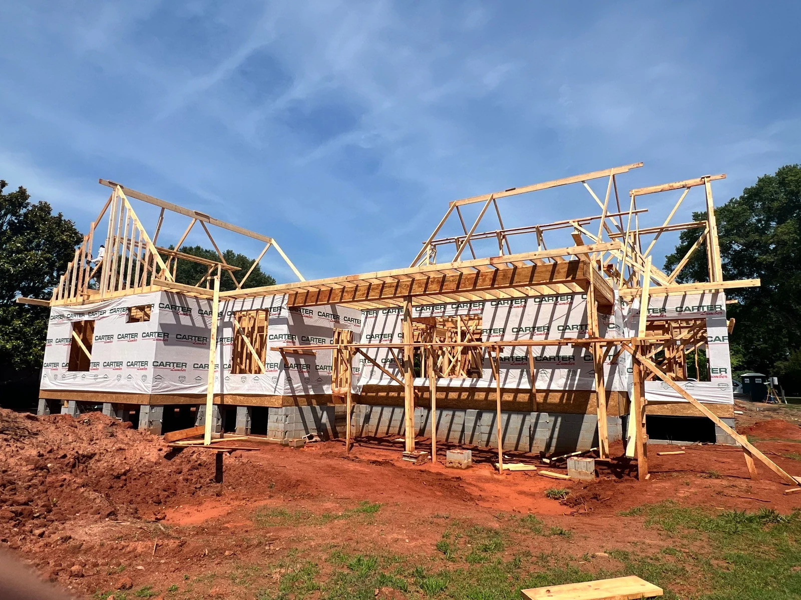 Custom home frame with roof trusses set