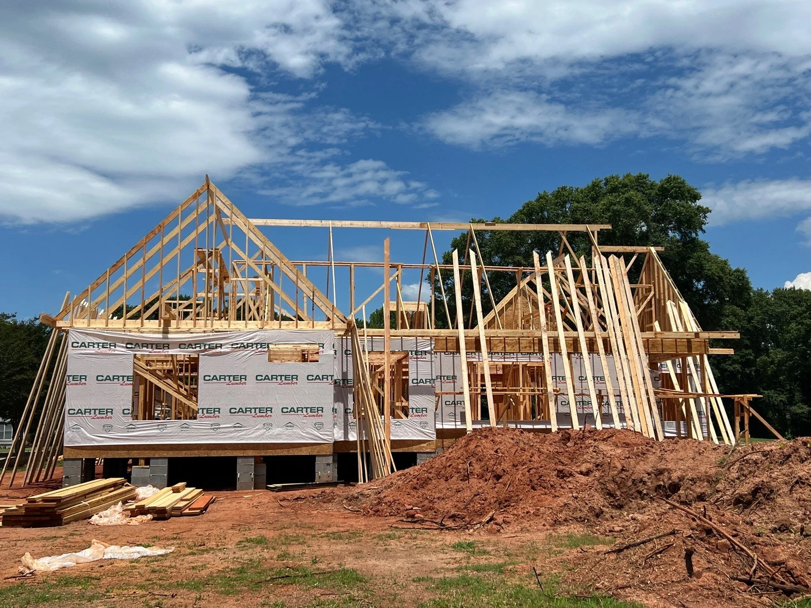 Custom home frame with roof trusses set