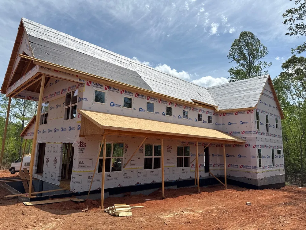 Newly built barndominium framed, wrapped, and dried in