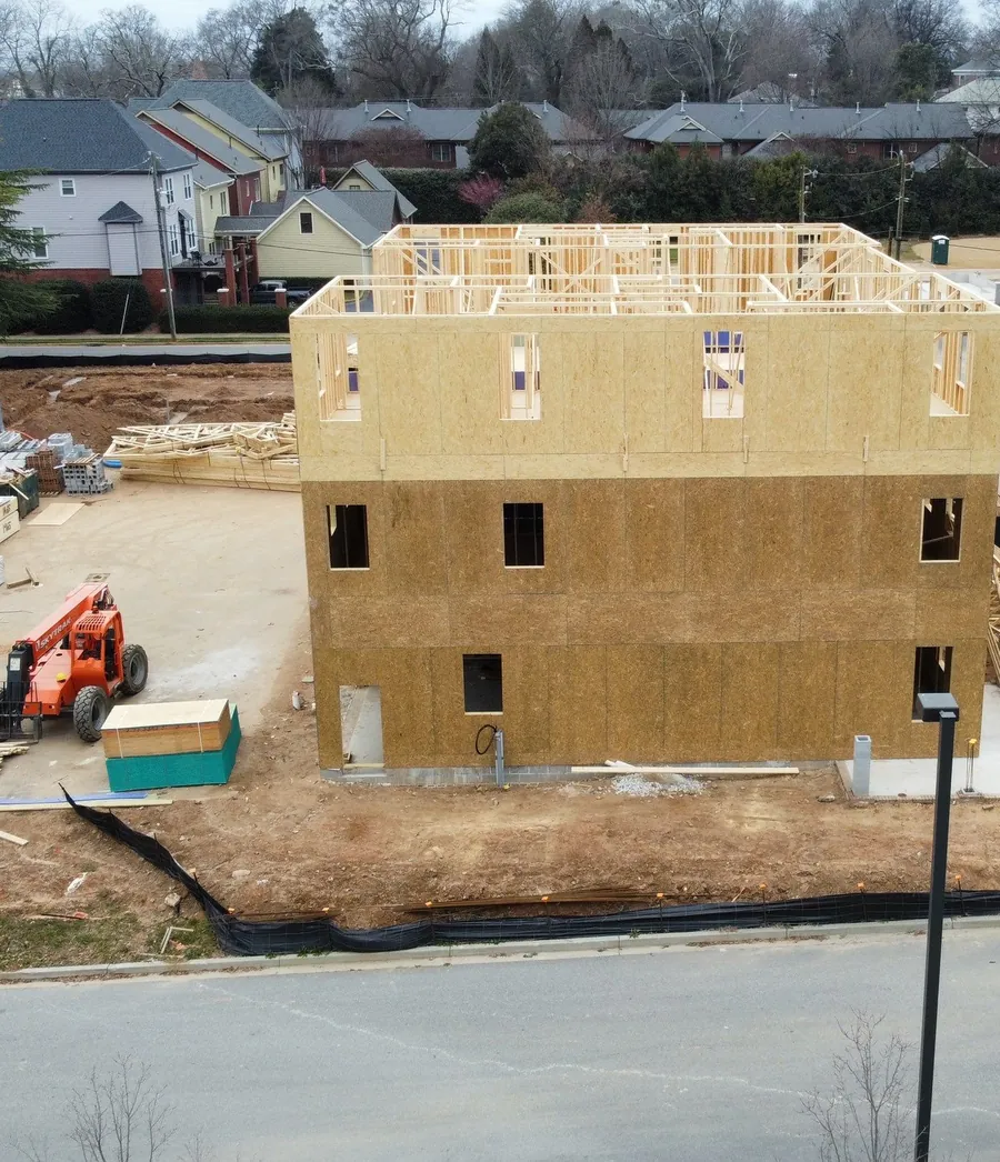 Three-story townhome block framed near downtown