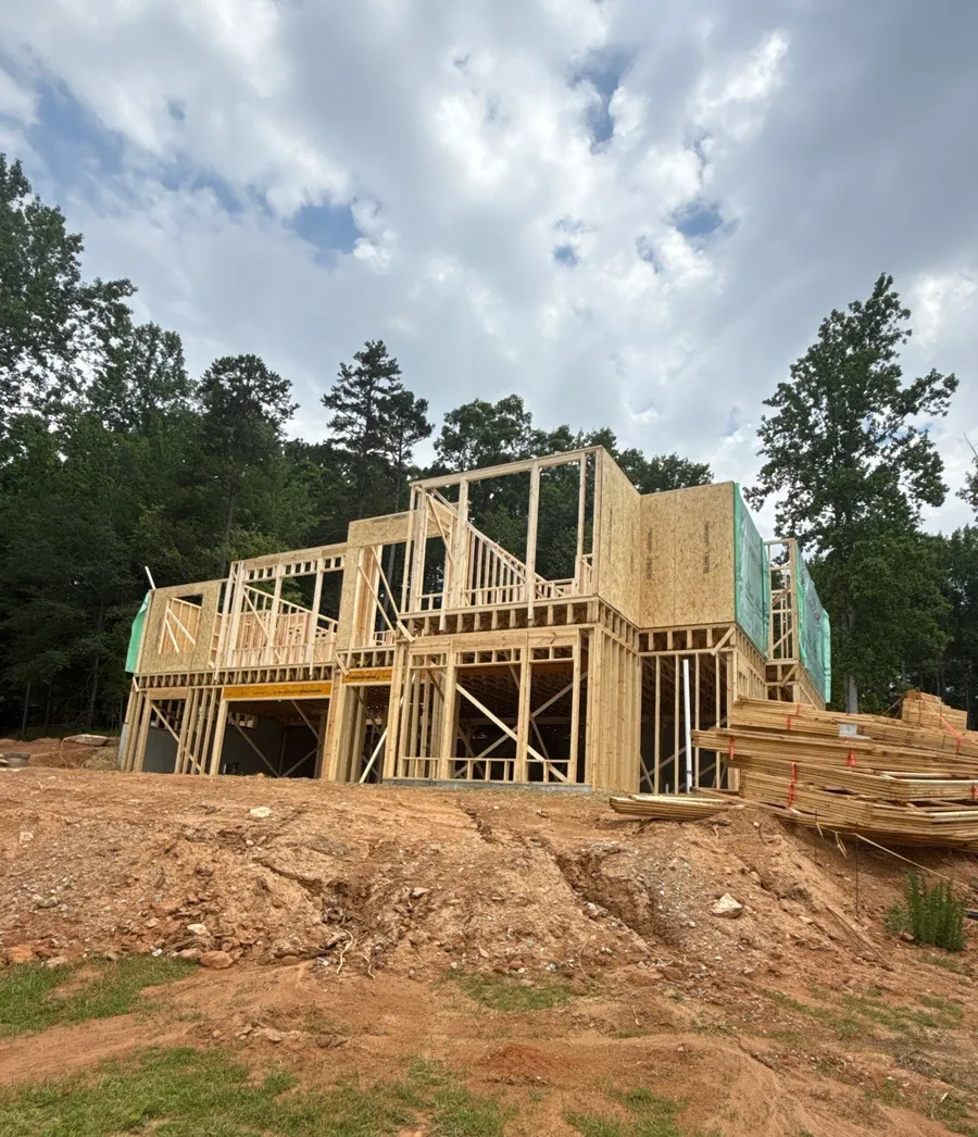 Hillside custom home frame overlooking the lake