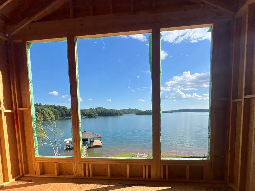Framed picture-window wall overlooking the lake
